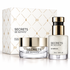 Coffret Secret sérum avec sérum pailleté et crème en pots transparents, écrins blancs et dorés raffinés
